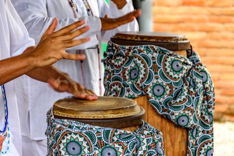 The atabaque being played by percussionists during a religious festival in Umbanda Belo Horizonte,