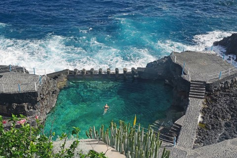 An oceanfront swimming area surrounded by rocks and waves, Charco Azul, San Andres, La Palma,