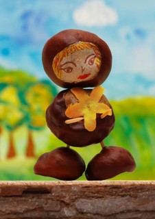 Cute chestnut figure in front of a painted background, North Rhine-Westphalia, Germany, Europe