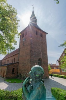 Svendborg Old Town, St. Nicolai Church, brick building, stepped gable, church tower, backlight,