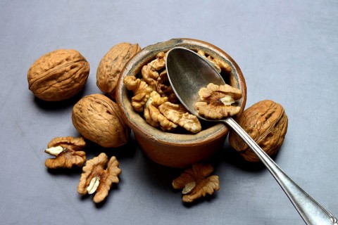Walnut, walnuts in pots with spoon, Juglans regia