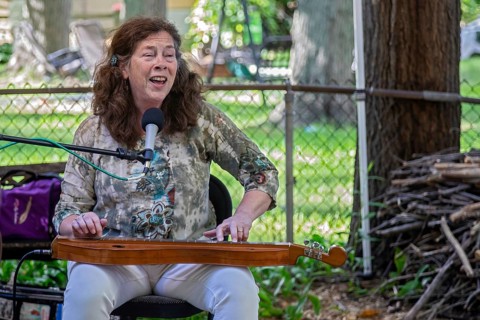 Southfield, Michigan, Claudia Schmidt sings at a backyard concert