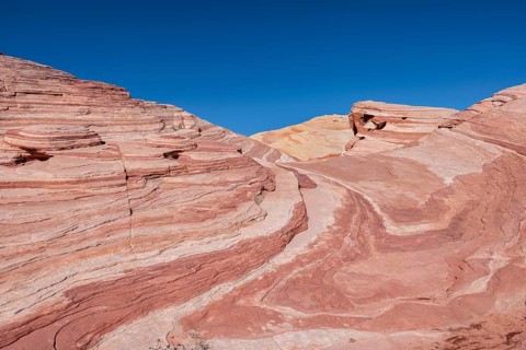 Layered rock formations along the Fire Wave Trail at Valley of Fire State Park near Overton, Nevada