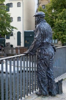B&W Worker, sculpture by Jens Galschiøt, Børnehusbroen, Christianshavns Kanal, Copenhagen, Denmark,