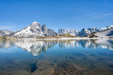 Mountain landscape with mountain lake, water reflection in Lac Blanc, mountain peak, Aiguille