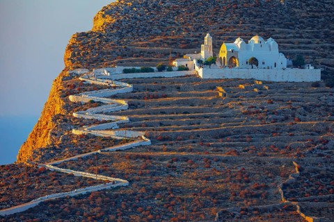 View of Panagia Kimissis church built on a cliff above the sea, Chora, Folegandros Island, Cyclades