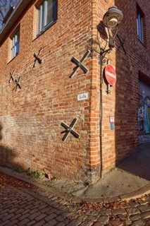 Wall anchor and lantern on a brick building, Kolk street, Hanseatic city of Lübeck,