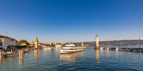 Harbour with the Hotel Bayerischer Hof, man tower, excursion steamer and the lighthouse, Lindau