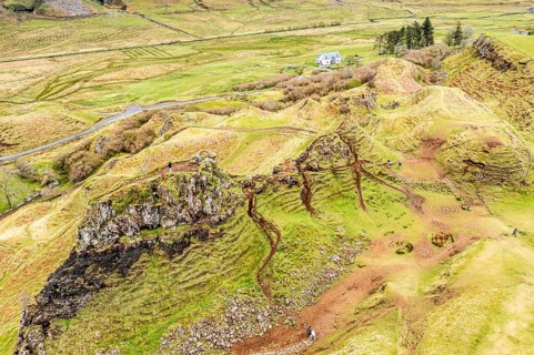 Aerial view of castle Ewen, a rock formation looking like a castle, Fairy Glen, Isle of Skye,