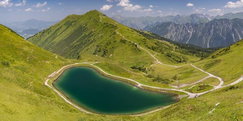 Riezler Alpsee, an artificial lake, snow pond, feeds the snow cannons that completely cover the