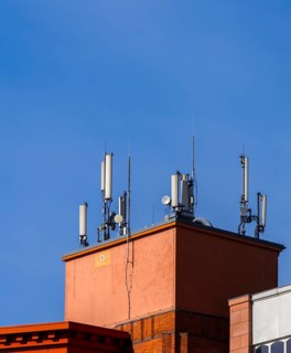 Transmission masts and mobile phone antennas on a rooftop, Berlin, Germany, Europe