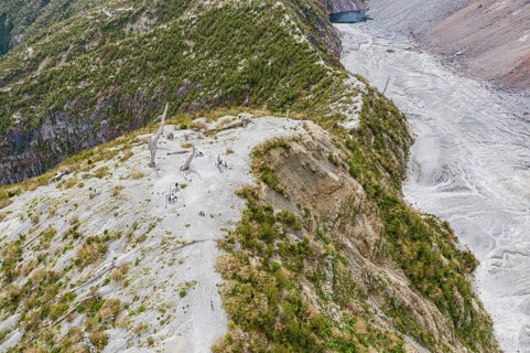 Tourists at the viewing point, hike to crater rim of Chaiten volcano, Park Pumalin, Patagonia,