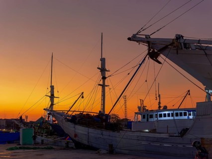 Old wooden ships, schooners and sailing ships, sunset, harbour of Makasar, Sulawesi, Indonesia,