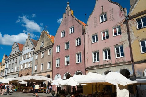 Charming old town with pastel-coloured buildings and sunlit market stalls, Old Town, Olsztyn,