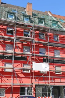 Painting work: Old building gets a new coat of paint