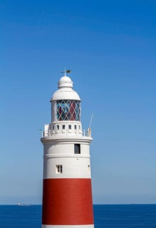 Red and white striped lighthouse at Europa Point, Gibraltar, British territory in southern Spain,