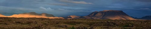 Large lava field and volcanic crater in the midnight sun, clouds, mood, panorama, Burfellshraun,