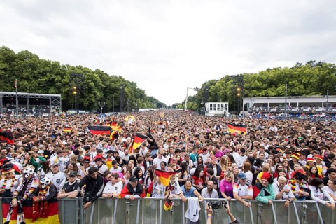 Football fans in the fan zone at the Brandenburg Tor during the quarter-final match between Germany
