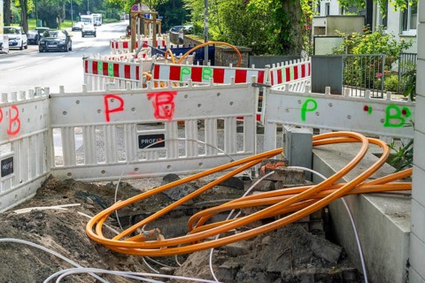 Laying of fibre optic cables, empty conduits are laid under a pavement, in which the actual fibre
