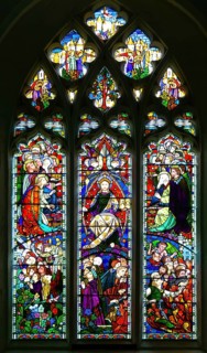 Stained glass window depicting Jesus Christ in Majesty, church of Saint Mary, Kempsford,