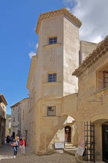 House with corner tower and tourists, mountain village, Les Baux-de-Provence, Alpilles, Alpilles,