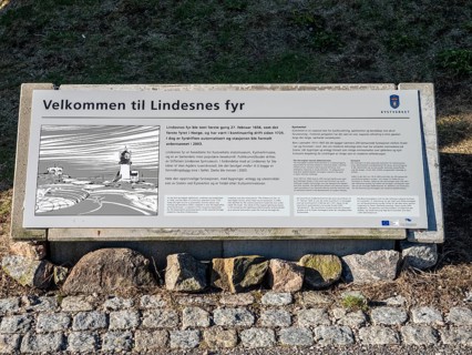 Sign describes history of lighthouse Lindesnes Fyr, at Cape Lindesnes, southern point of Norway,