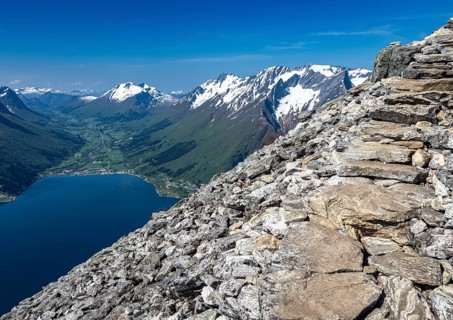 View over the Hjørundfjord on a sunny day in spring, seen from hike up to top of mountain Saksa,