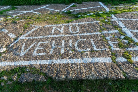 No Vehicles painted sign on ground surface to restrict parking, Shingle Street, Suffolk, England,
