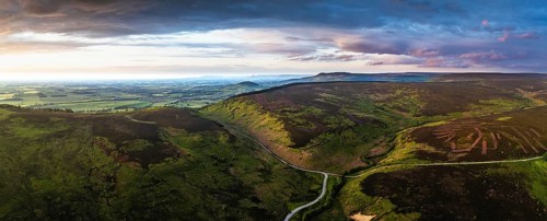 Panorama of Sunset over Cod Beck Reservoir from a drone, North York Moors National Park, North