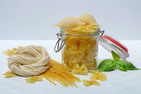 Various types of pasta with glass container, pasta varieties