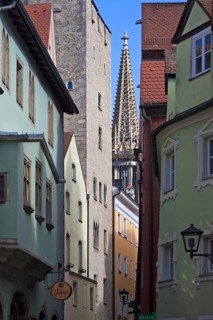 View through an old alley to the tower of St Peter's Cathedral, Regensburg, Upper Palatinate,