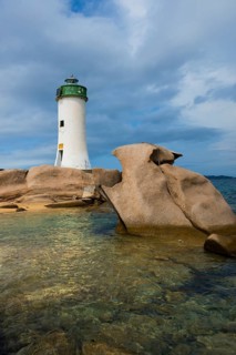 Lighthouse with beach and bizarre granite rocks, Spiaggia Porto Faro, Faro di Punta Palau, Palau,