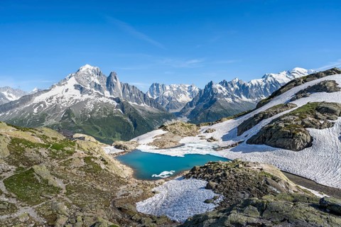Mountain landscape with mountain lake Lac Blanc, mountain peaks, Aiguille Verte, Grandes Jorasses,