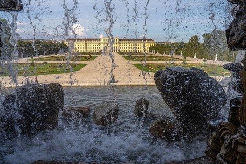 View through the Neptune Fountain to Schönbrunn Park and Palace, UNESCO World Heritage Site in