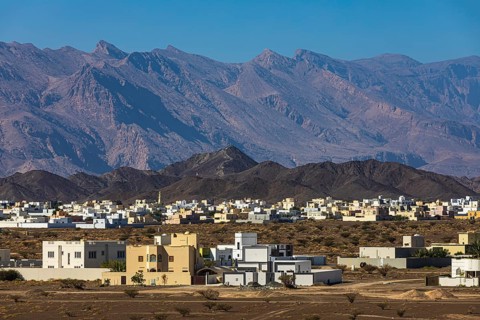 The new settlement of Jabrin, view from the palace fortress of Jabrin, behind the mountains of