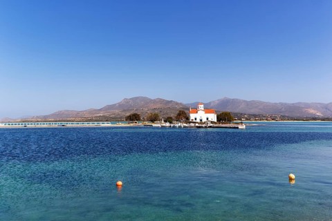 Small church Spiridon, island at the harbour entrance with bridge for access, Elafonisos, Deer