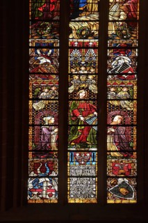 Colourful stained glass window by Alexander Linnemann 1901 with patron saint St. Cecilia for church