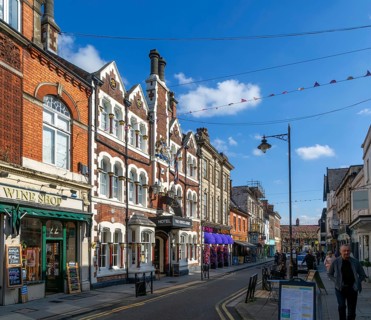 Historic buildings the Kings Arms Hotel and shops in Wood Street, Old Town, Swindon, Wiltshire,
