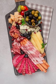 Appetizer, assortment, set, sausage, and cheese, on a wooden board, top view, no people
