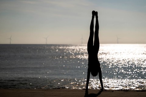 Girl doing a handstand by the sea, Silhouette, Søndervig Strand, North Sea, Denmark, Europe
