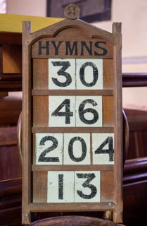 Hymn numbers on display in church, Church of All Saints, Ashbocking, Suffolk, England, UK