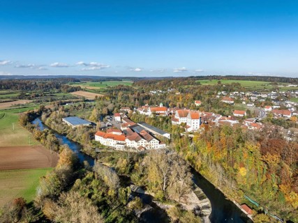 Aerial view of the village of Scheer with the residential palace and the former Kraemer paper mill,