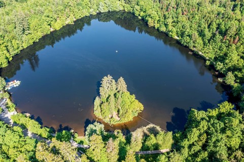 Lake Bergsee ('mountain lake') near Bad Säckingen, island in the lake, boat dock of rental boats,