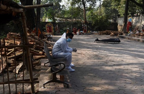 A family member mourns as a person died of COVID-19 coronavirus disease, at a cremation ground in