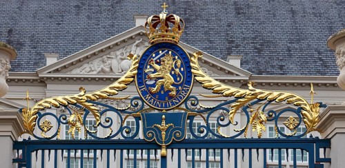 Coat of arms with the Dutch motto Je Maintiendrai, above the entrance to the Royal Palace