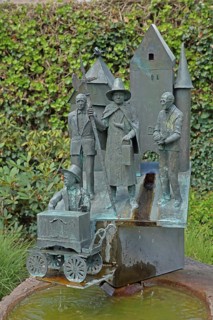 Historian's fountain with figures on the town's history, four, sculptures, bronze, barrel organ