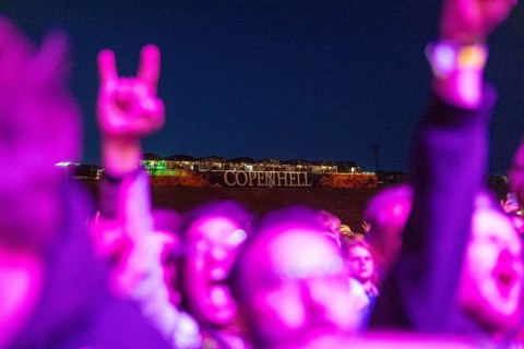 Copenhagen, Denmark - 19.6.2024: Festivalgoers with hands shaped like French fries in front of the
