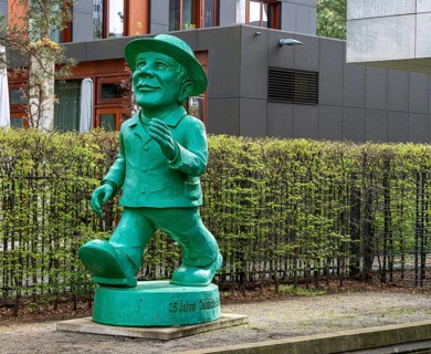 Green Ampelmann figure in the garden of the Hessian State Representation, Berlin, Germany, Europe