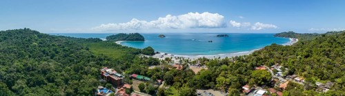 Aerial view, coast and town, Corrohoe Bay and Playa Espadilla, Manuel Antonio National Park,