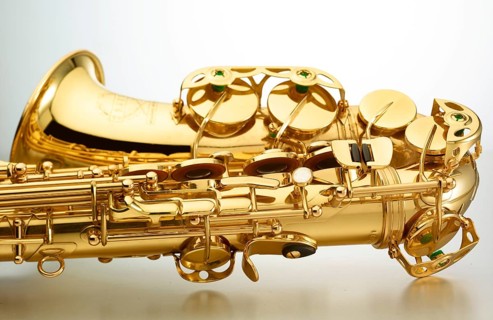 Saxophone in front of white background, detail, studio shot